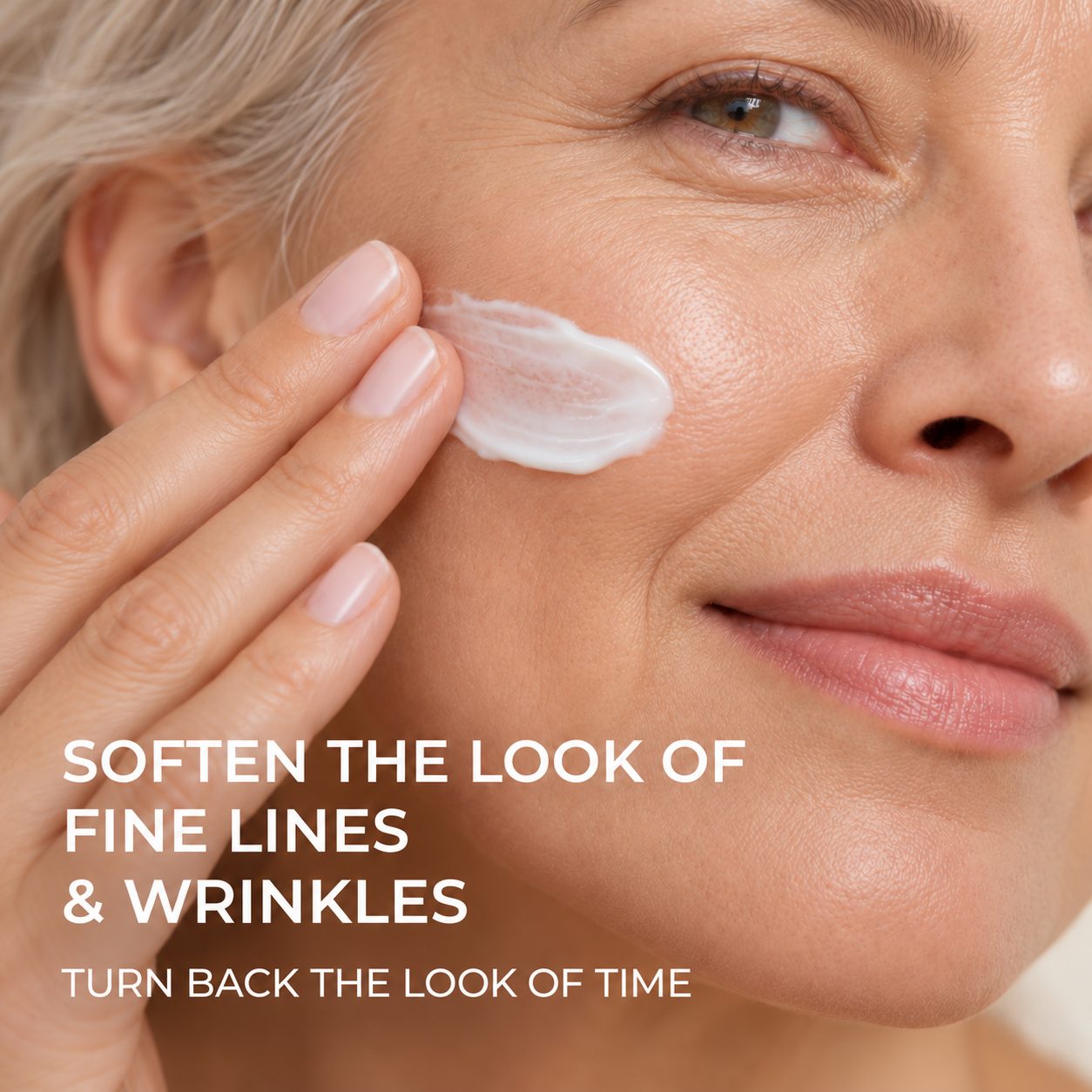 Woman applying Atelier de Seoul serum-moisturizer to her cheek